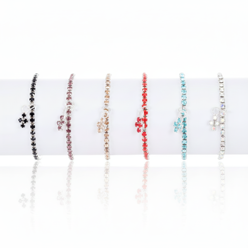 Bransoletka ZIRCONI z krzyżykiem – elegancka biżuteria w różnych kolorach.