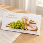 Elegancka koperta komunijna na pieniądze – zbliżenie symboli Eucharystii